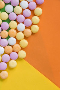 Candy on the colorful background, high angle view, circle candies