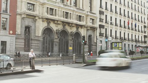 Car on street in front of buildings