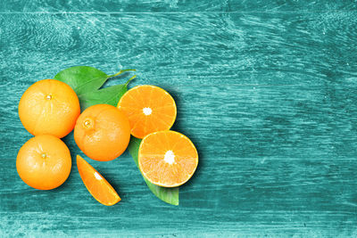 High angle view of orange fruits on wood