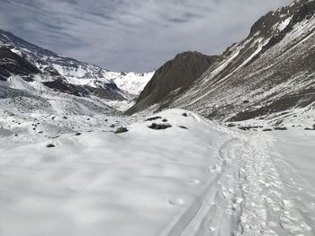 Scenic view of snowcapped mountains against sky