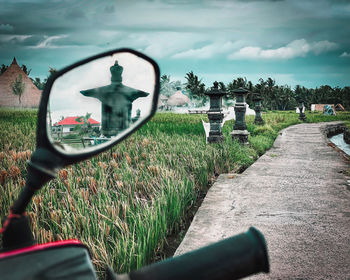 View of motorcycle on field against sky