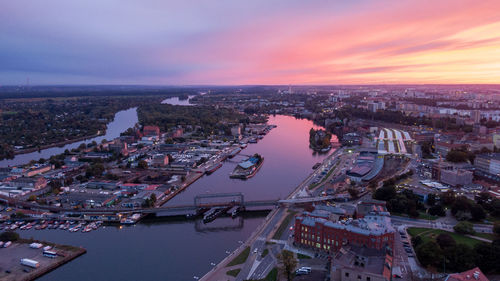 High angle view of city at sunset