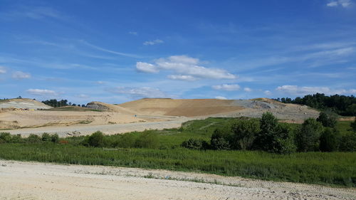 Scenic view of landscape against blue sky