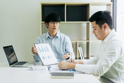 Young man using laptop on table