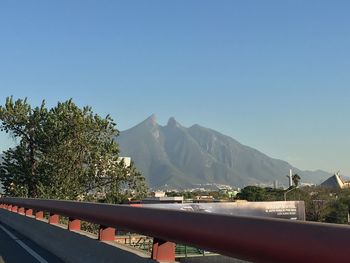 Scenic view of mountains against clear blue sky