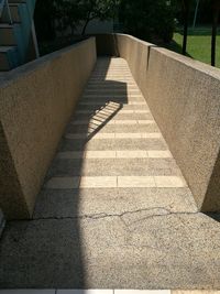 High angle view of shadow on footpath