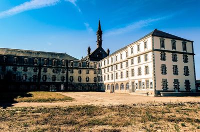 View of buildings against blue sky