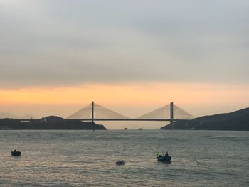 View of suspension bridge over sea