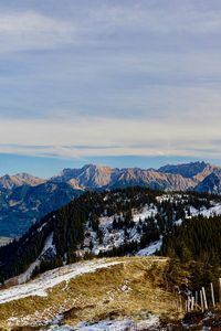 Scenic view of snowcapped mountains against sky