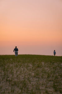 Scenic view of sea against clear sky during sunset