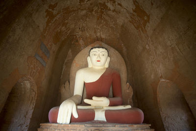 Low angle view of buddha statue at temple