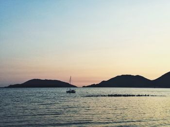 Scenic view of sea against clear sky during sunset