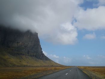 Road amidst landscape against sky