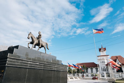 Low angle view of statue against sky