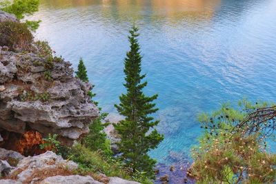 High angle view of rocks by lake