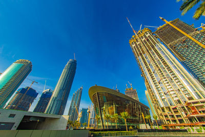 Low angle view of skyscrapers against sky