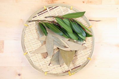 High angle view of leaves in basket on table