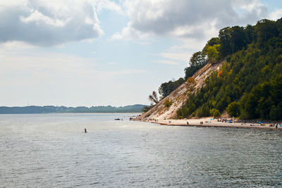 Baltic sea coast near sellin on the german island of ruegen with cloudy skies in summer.