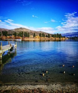 View of calm lake against mountain range