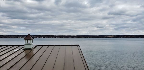 Pier over sea against sky