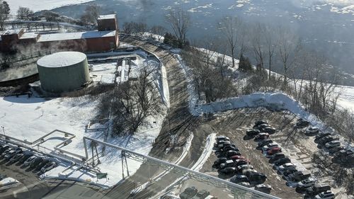 High angle view of road amidst trees during winter