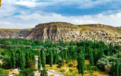 Scenic view of mountains against cloudy sky