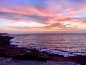 Scenic view of sea against dramatic sky