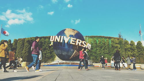 Rear view of woman standing against clear sky