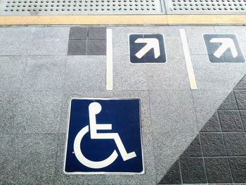 High angle view of sign on road