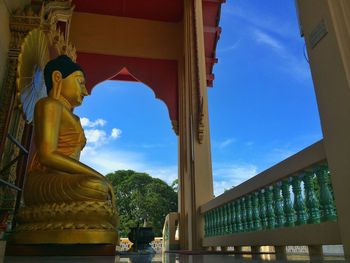 Low angle view of statue against clear blue sky