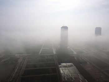 Aerial view of city against sky