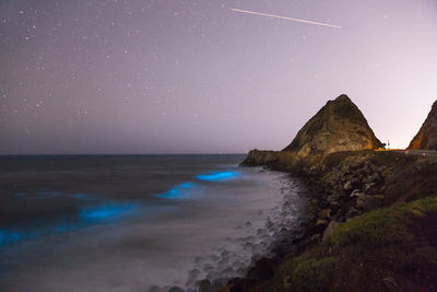 Scenic view of sea against sky at night