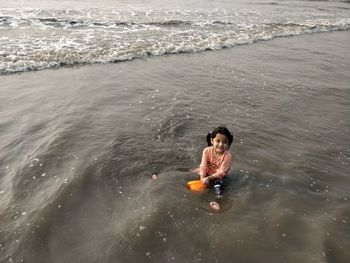 High angle view of boy in sea