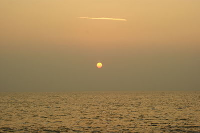 Scenic view of sea at sunset