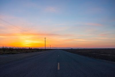 Road against sky during sunset