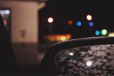 Close-up of illuminated car windshield at night