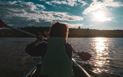 Woman paddles kayak on the lake.woman on the river kayak is paddling.recreations