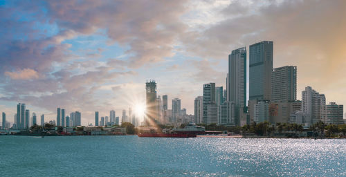 Modern buildings in city against sky