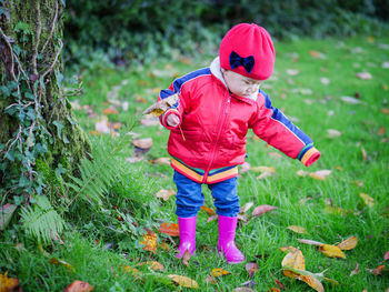 Cute baby boy standing at park