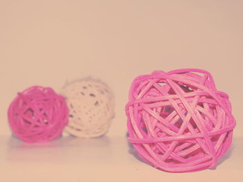 Close-up of wicker balls against white background