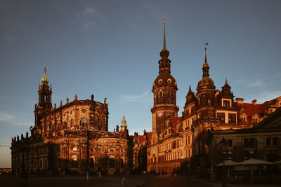 Low angle view of buildings against sky in city