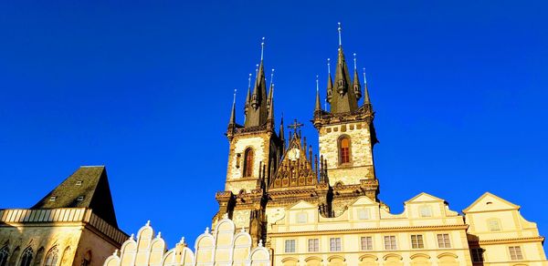 Low angle view of temple building against blue sky