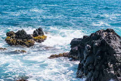 Scenic view of rocks in sea