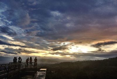 Scenic view of landscape against cloudy sky