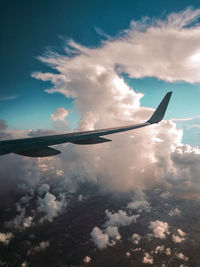 Low angle view of airplane flying against sky