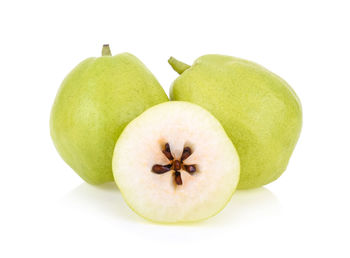 Close-up of pears against white background