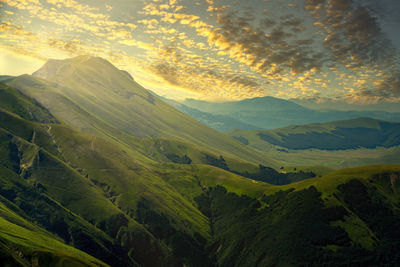 Scenic view of mountains against sky during sunset