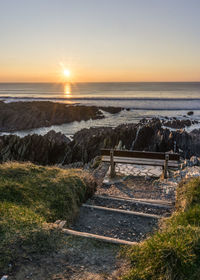 Scenic view of sea against clear sky during sunset