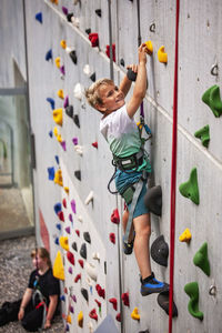 High angle view of woman standing on railing