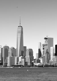 Modern buildings in city against clear sky